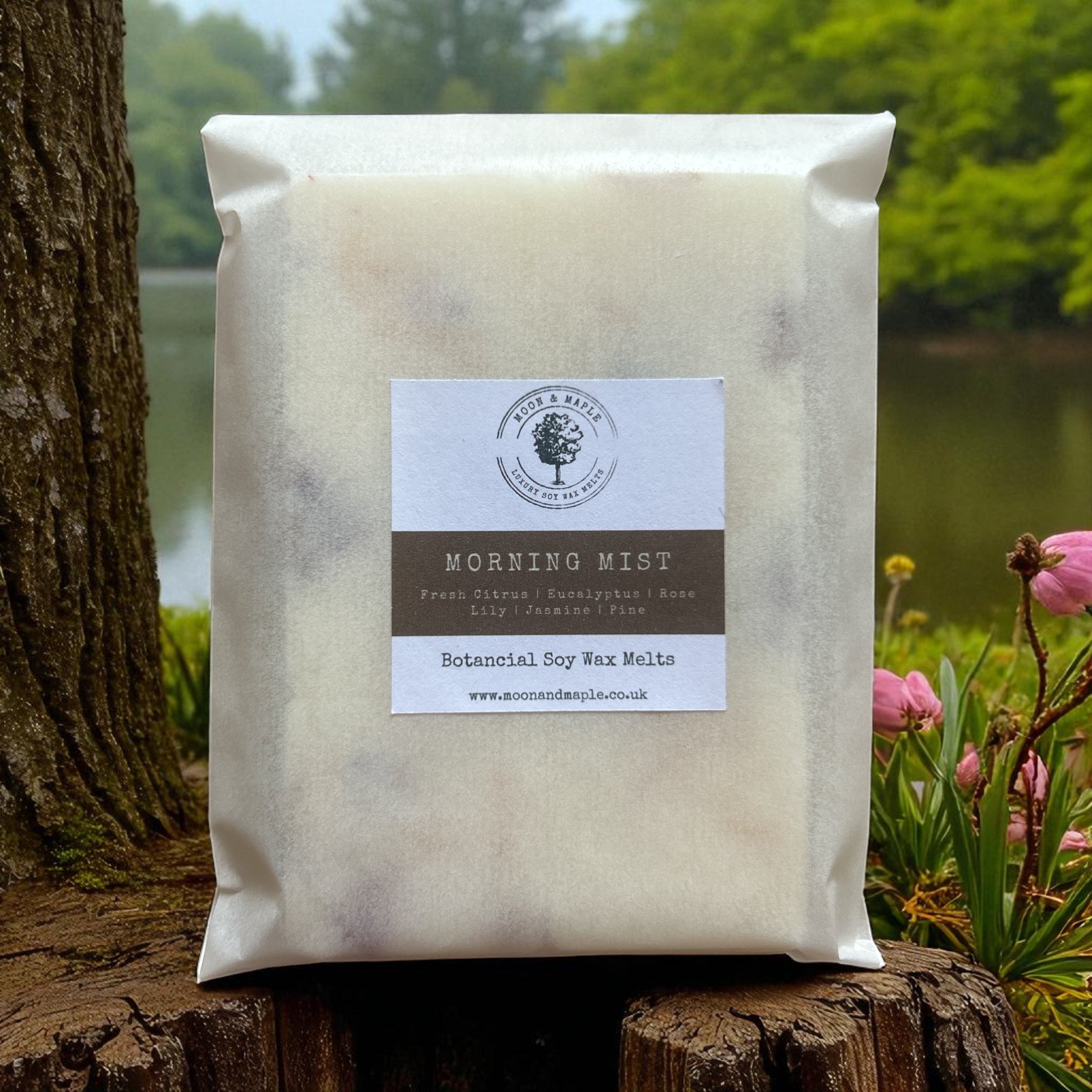 Pack of 'Morning Mist' wax melts on a wooden stump with a natural background
