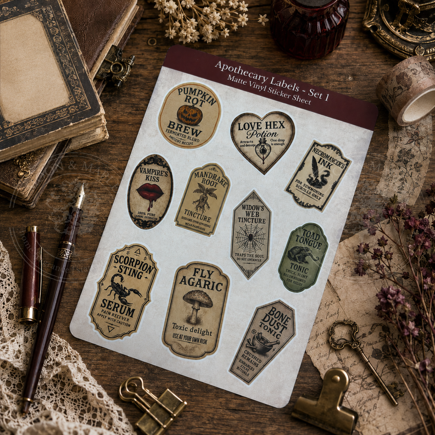 Sheet of apothecary labels on a rustic wooden surface with vintage items.