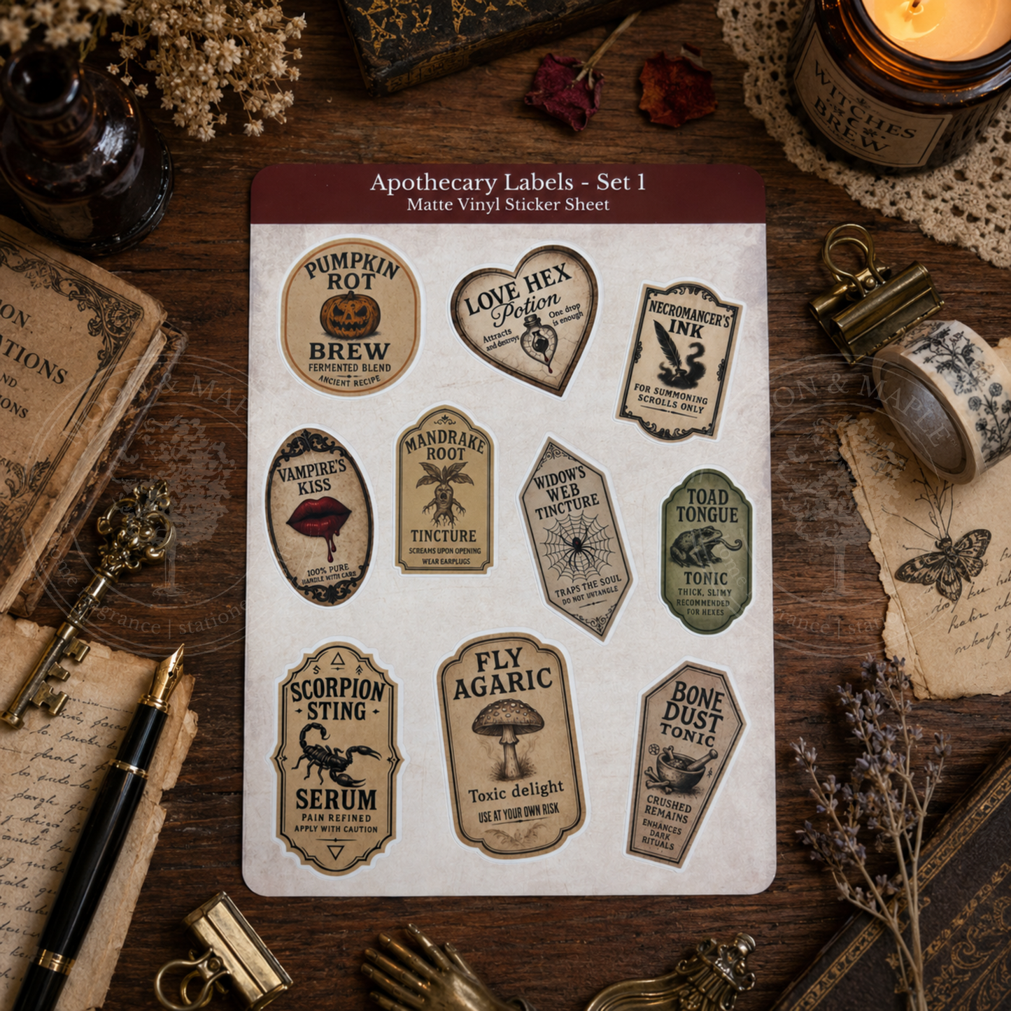 Sheet of apothecary labels on a wooden surface with vintage items.