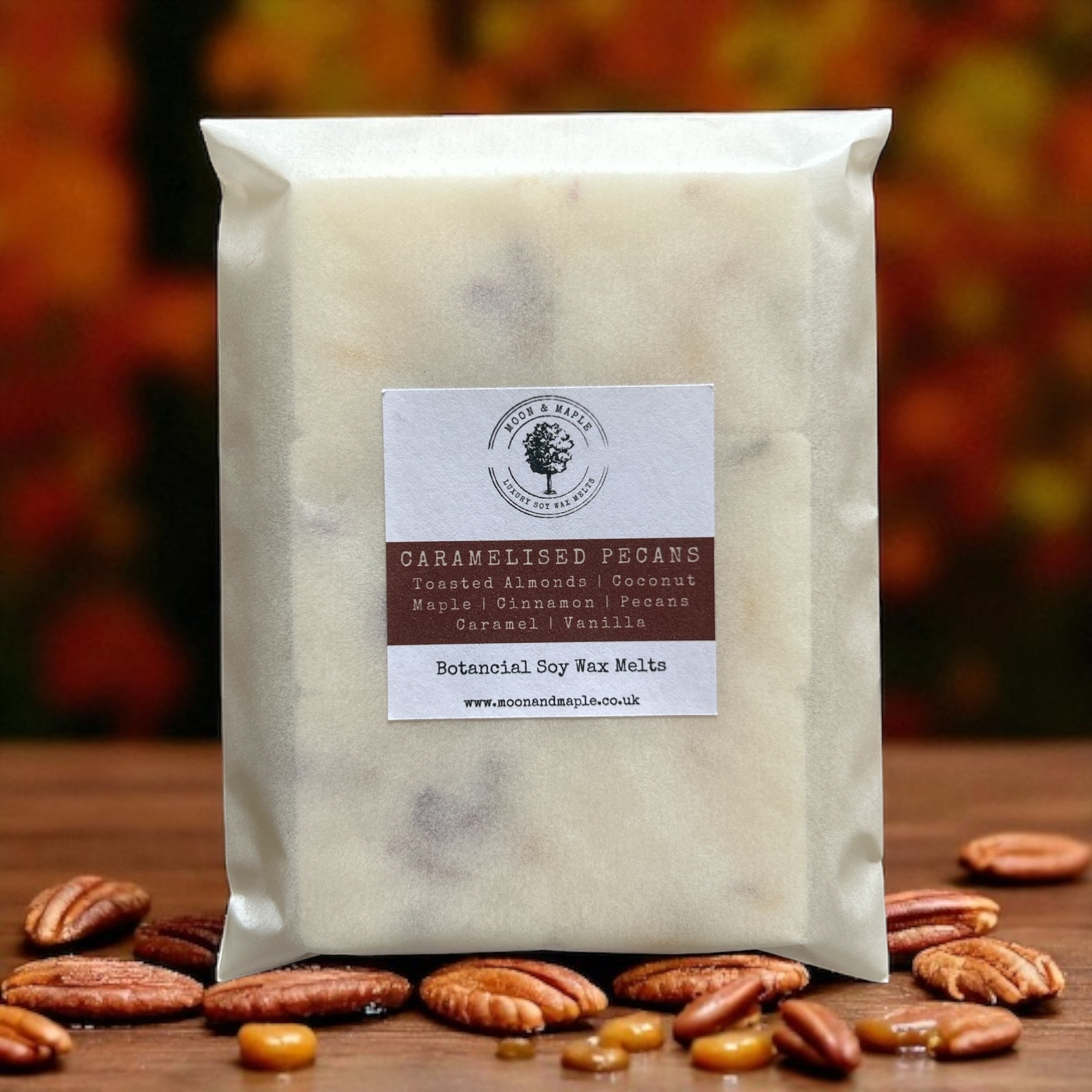 Bag of caramalised pecan wax melts with a label on a wooden surface