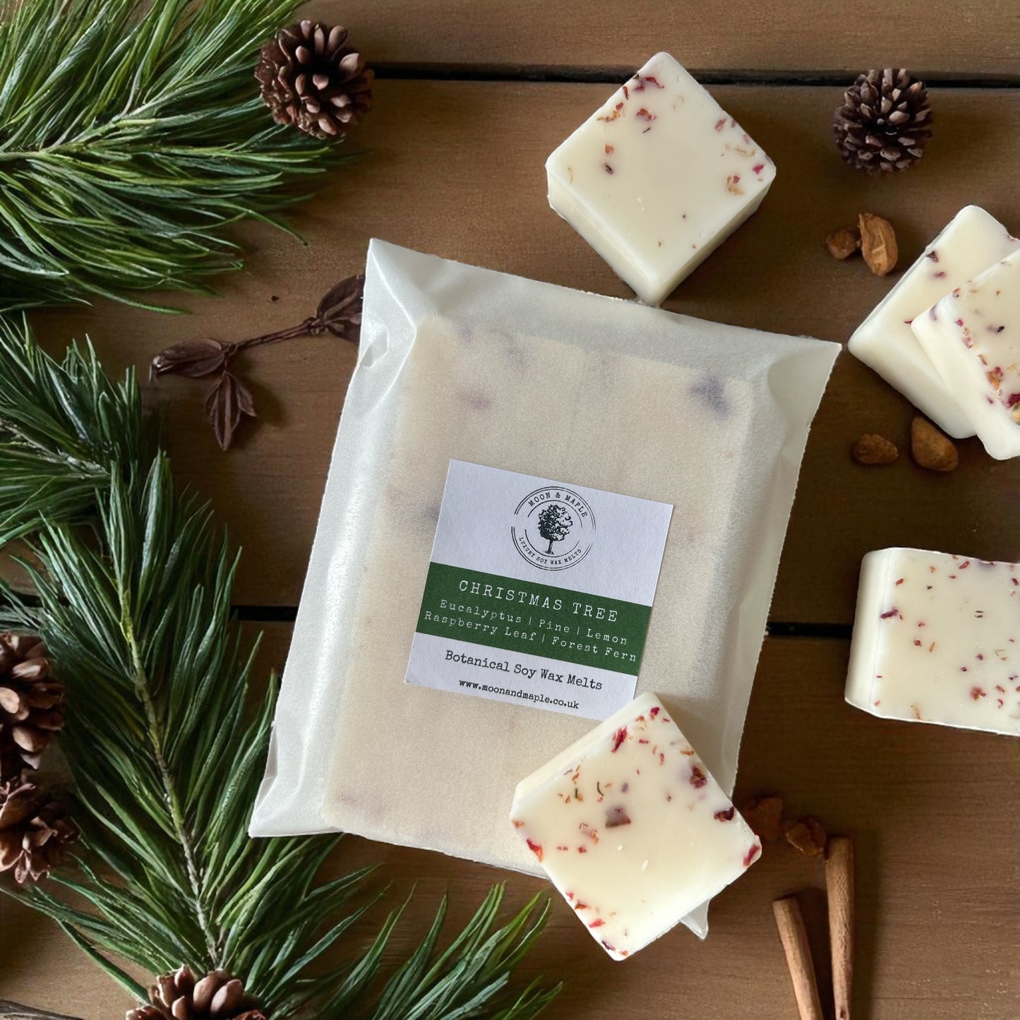 Christmas Tree Soy Wax Melts - The Christmas Collection with pine and eucalyptus scents, surrounded by festive decor.