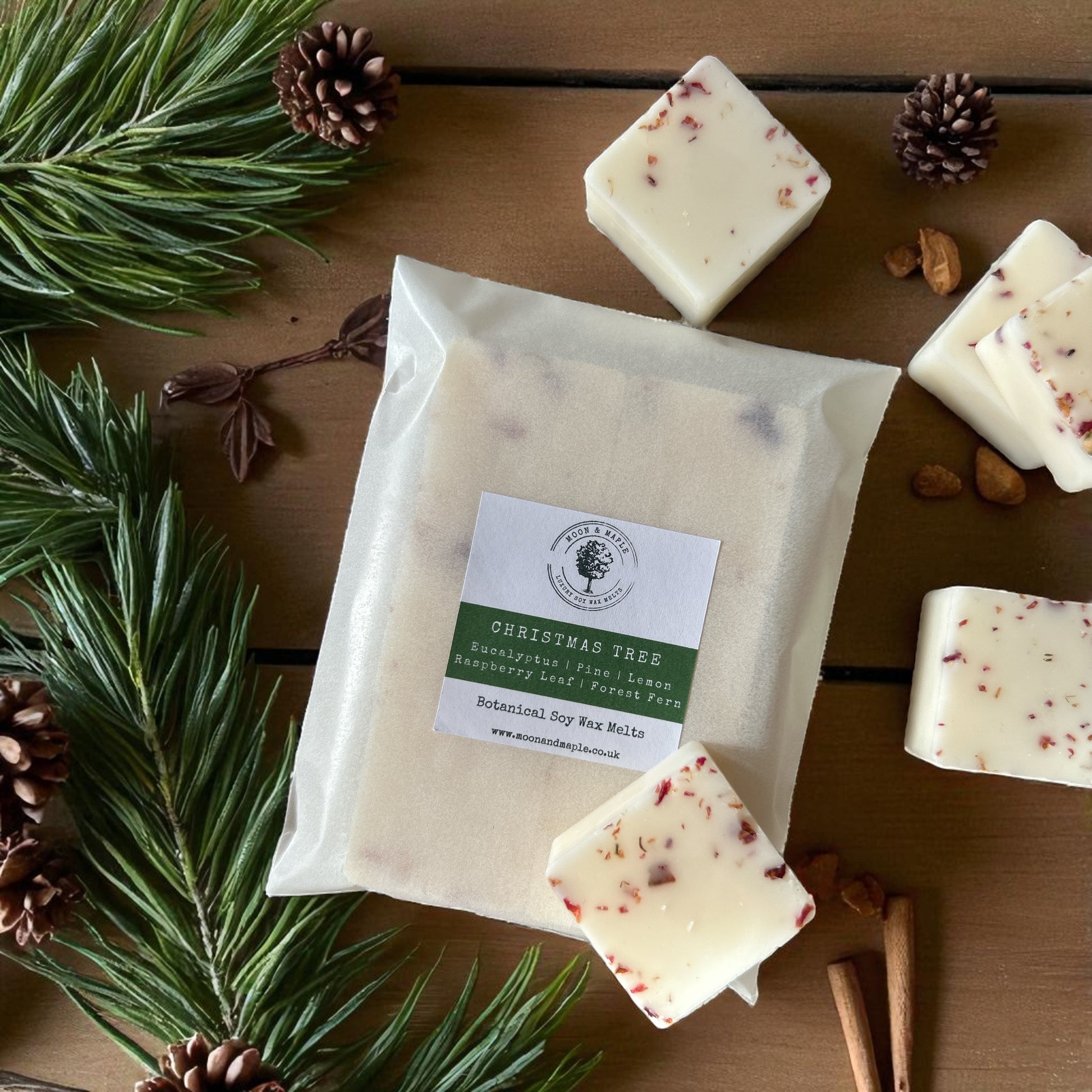 Christmas Tree Soy Wax Melts - The Christmas Collection with pine and eucalyptus scents, surrounded by festive decor.