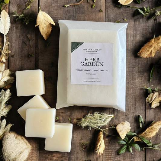 Herb Garden soy wax melts on a wooden surface with natural elements.
