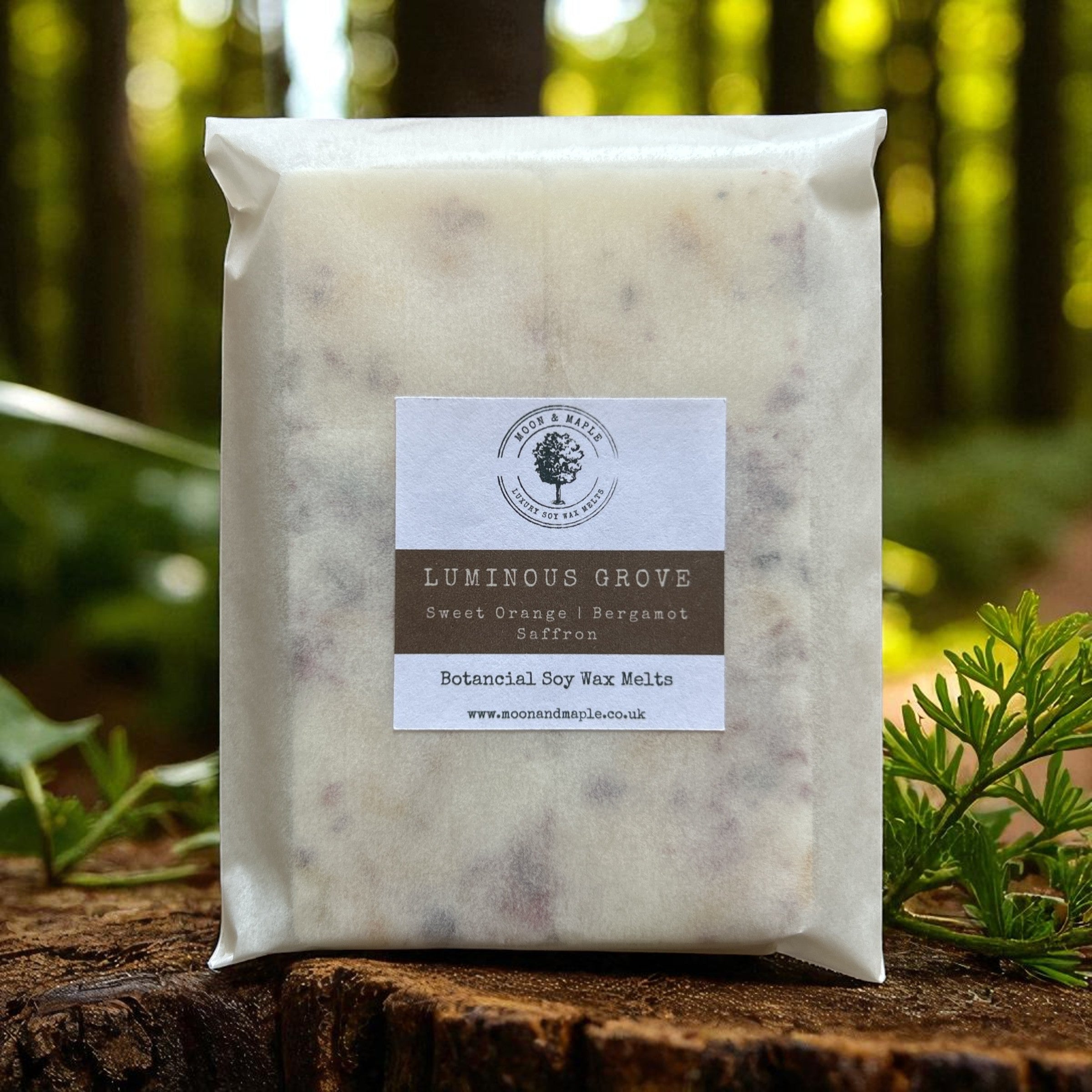 Packaged wax melts with a label on a wooden surface and natural background