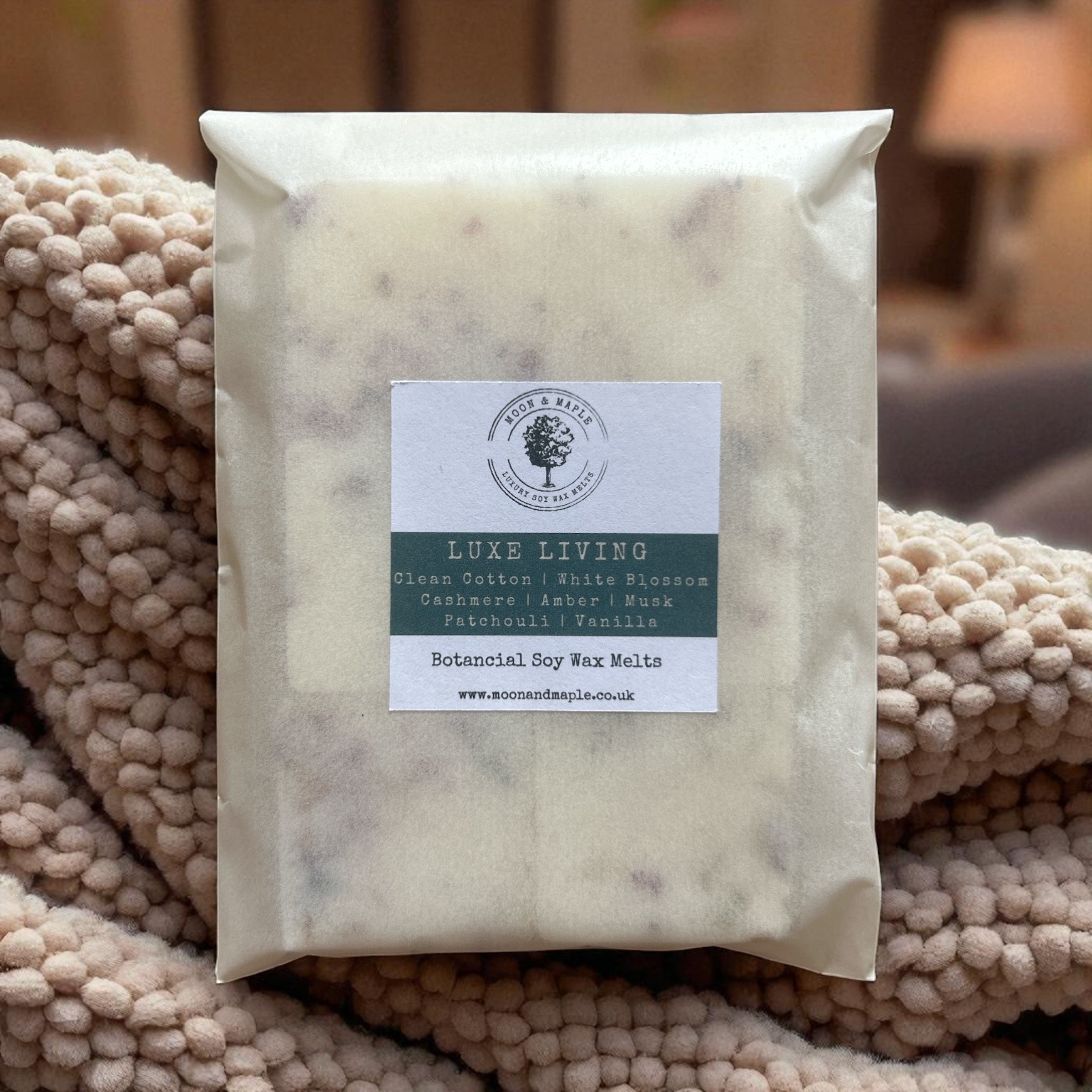Packaged wax melts with a label on a textured surface