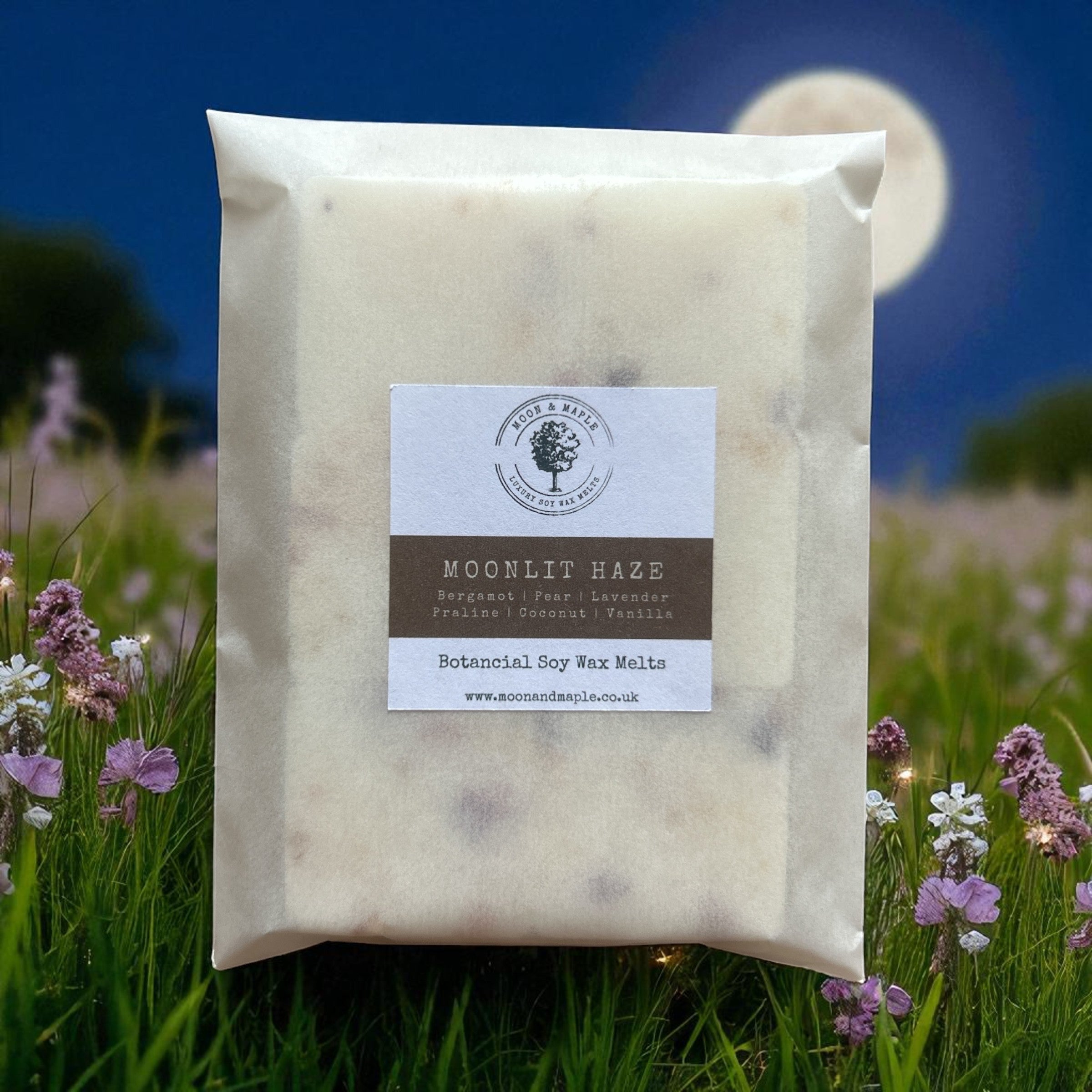 Packaged wax melts with a label on a background of a moonlit field with flowers.
