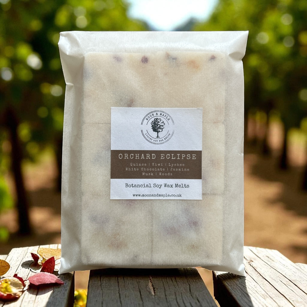 Packaged product labeled 'Orchard Eclipse' on a wooden surface with a natural background