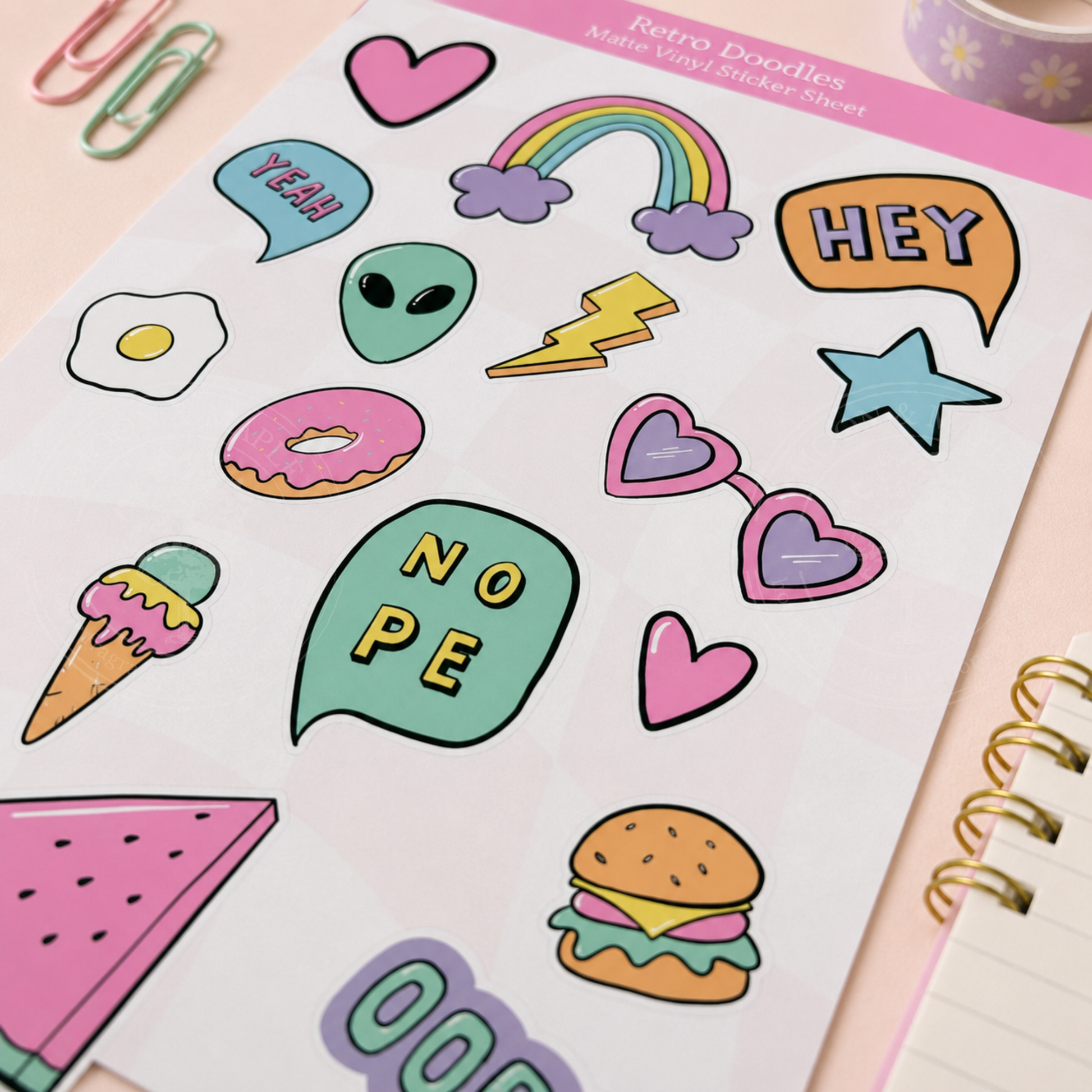 Sheet of colorful stickers with various designs including hearts, rainbows, and food items on a pink background.