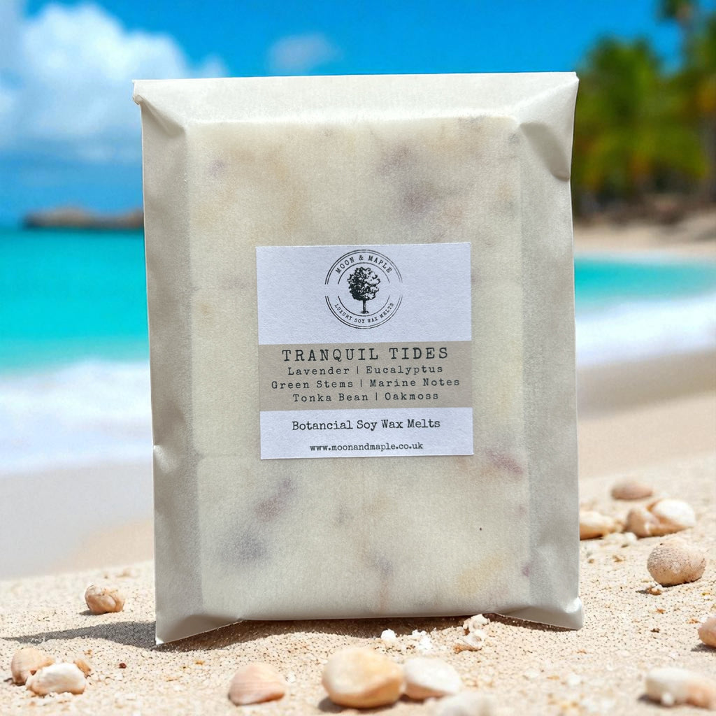 Packaged product labeled 'Tranquil Tides' on a beach with turquoise water and blue sky.