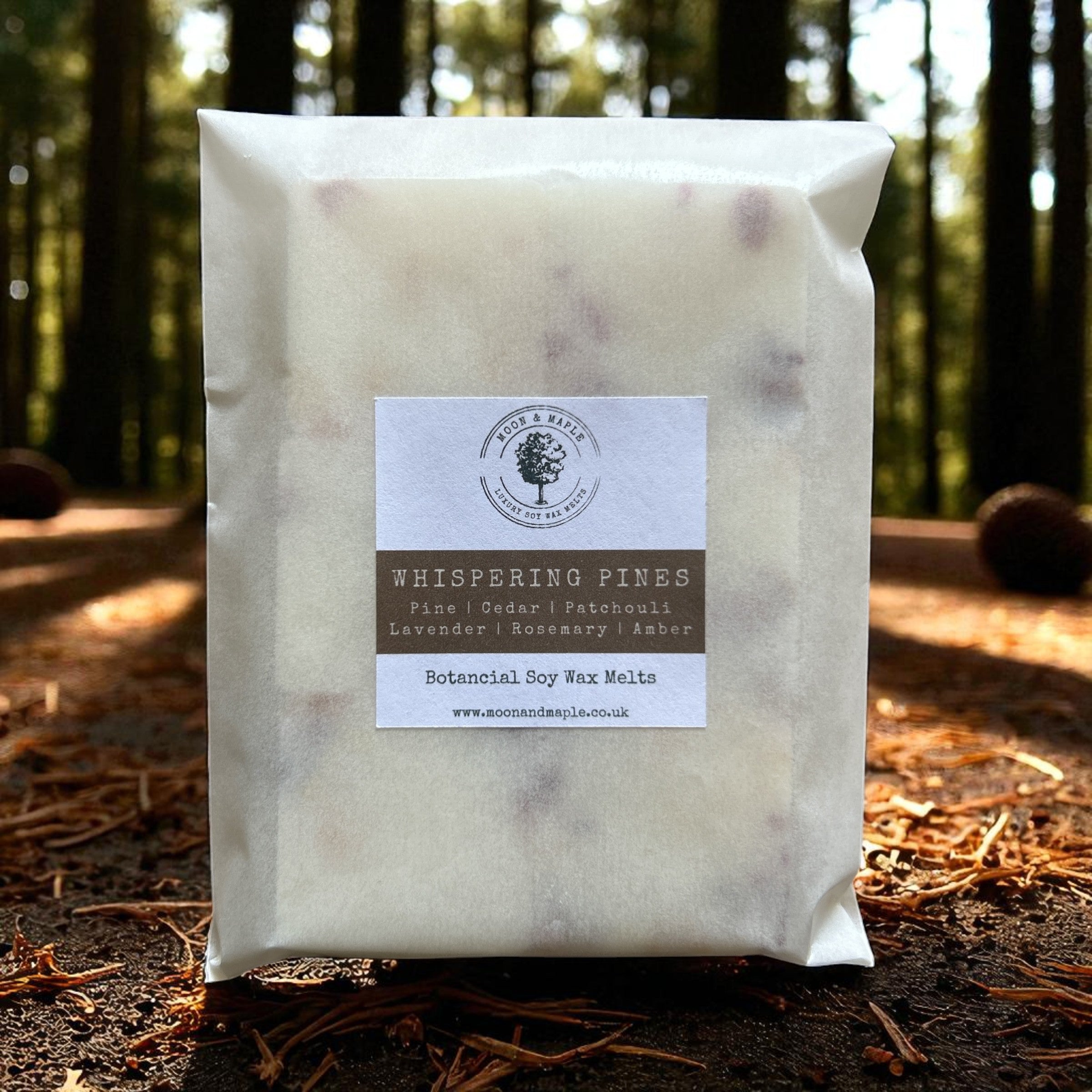 Pack of 'Whispering Pines' botanical soy wax melts with a forest background